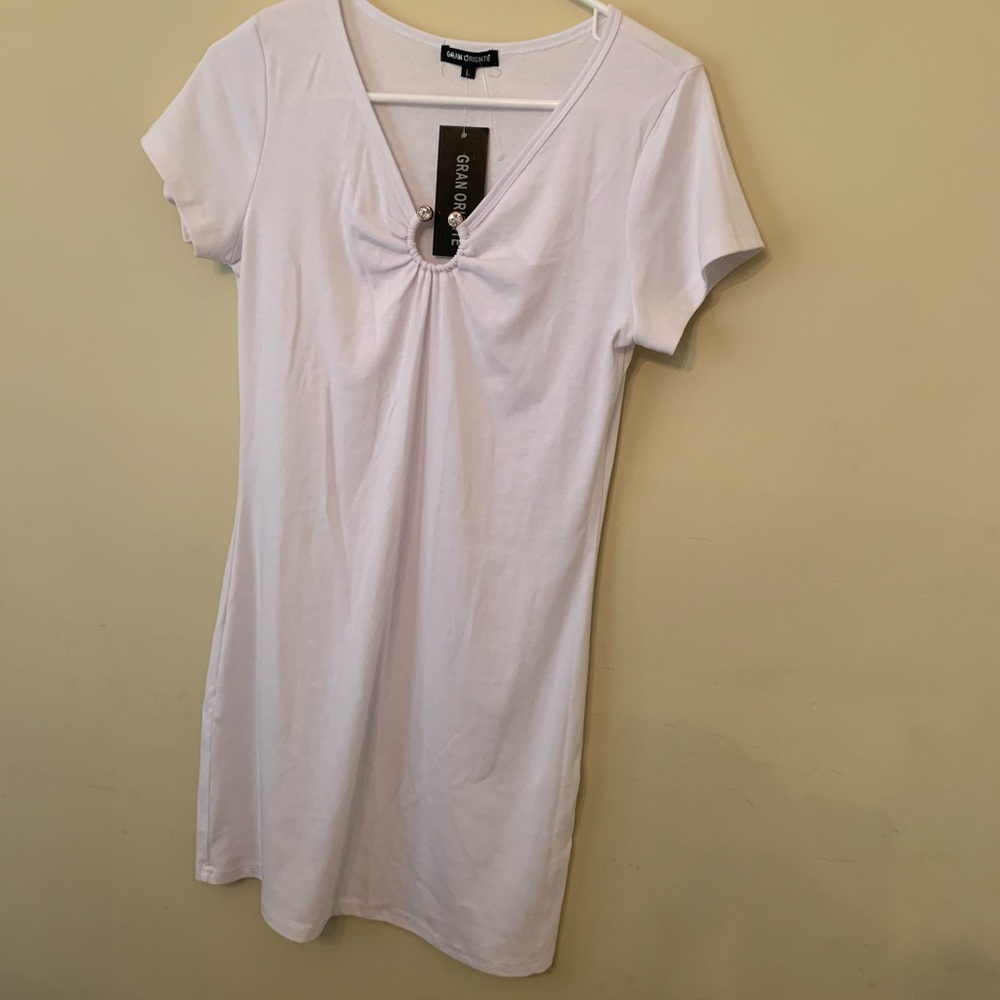 White T-Shirt style blouse with brooch Ring.